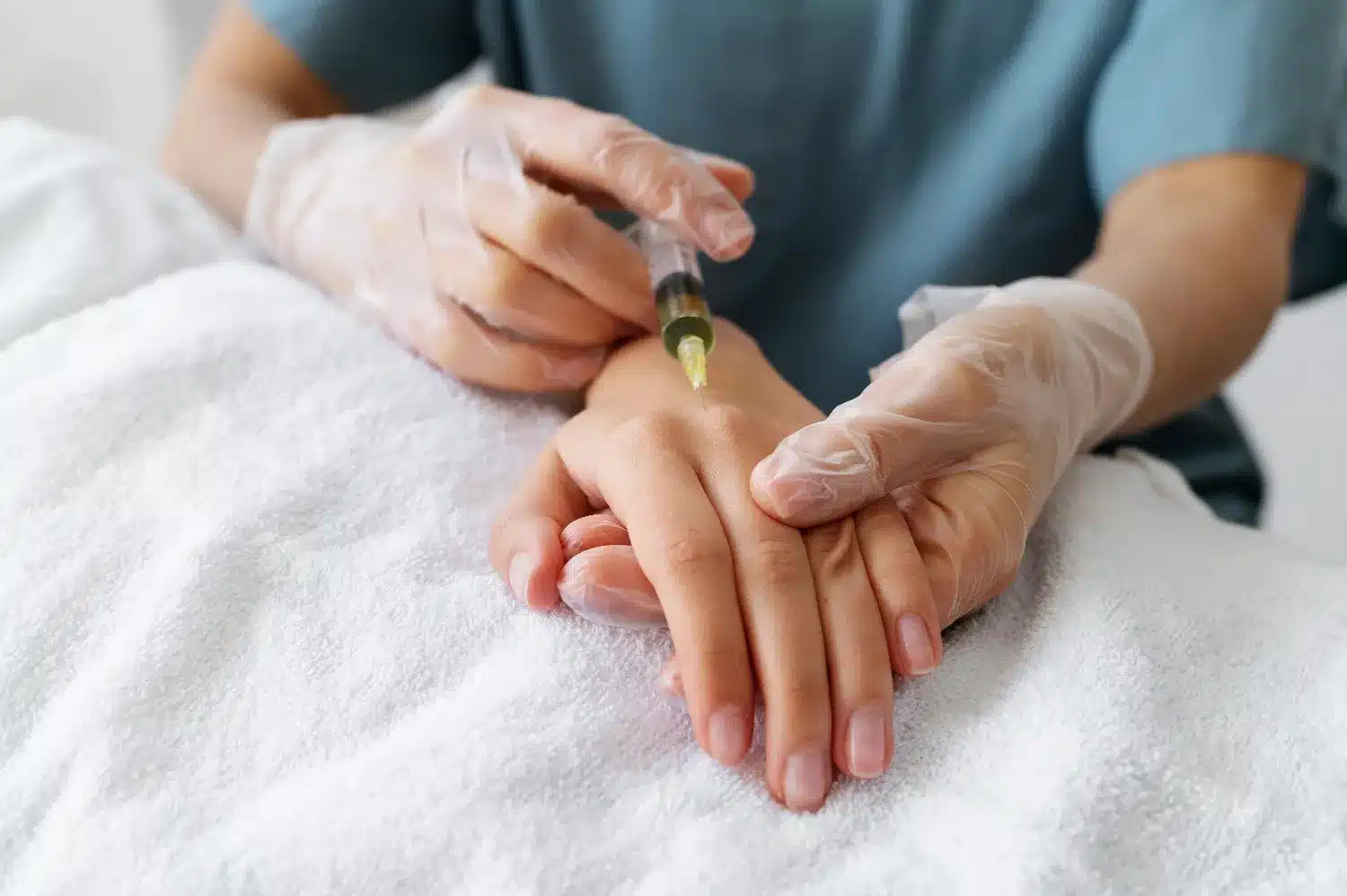 woman receiving Radiesse hand rejuvenation fillers